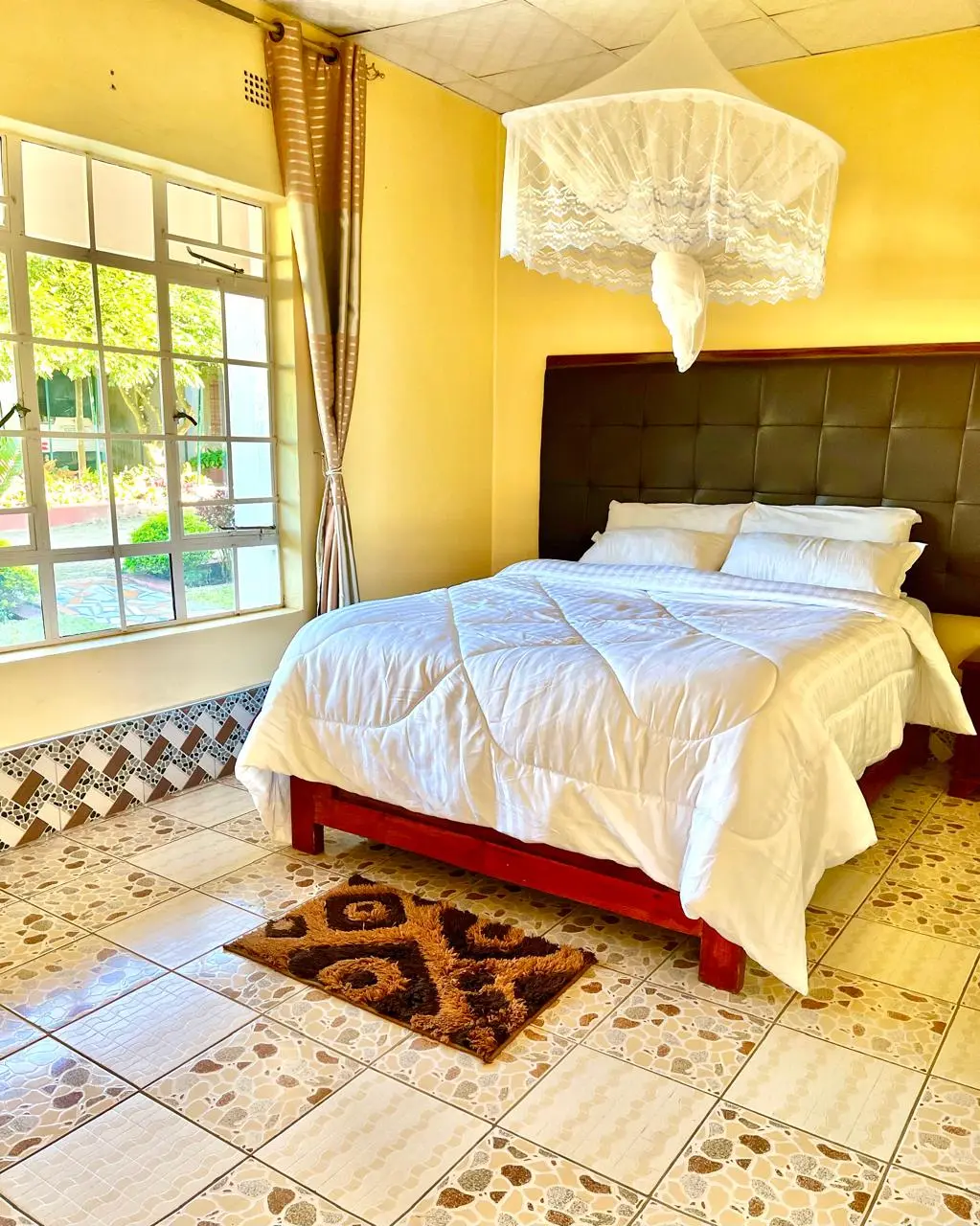 Second view of a prepared guest room at Linda’s Lodge
